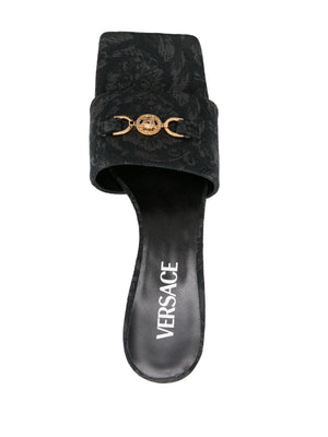 VERSACE Eye-Catching Black Women's Sandals with Embossed Baroque Design for SS24