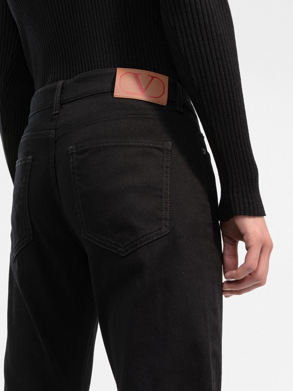 VALENTINO Slim Fit Black Denim Pants with Distinctive Red Logo