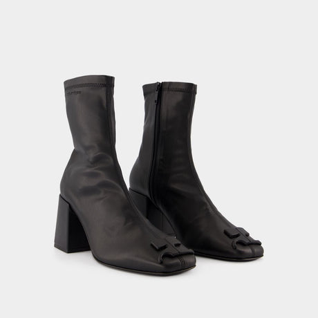 COURREGÈS Chic Mini Ankle Boots in Black Eco-Leather