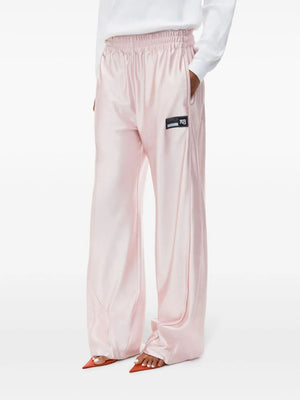 ALEXANDER WANG Embossed Logo Track Pants in Nude