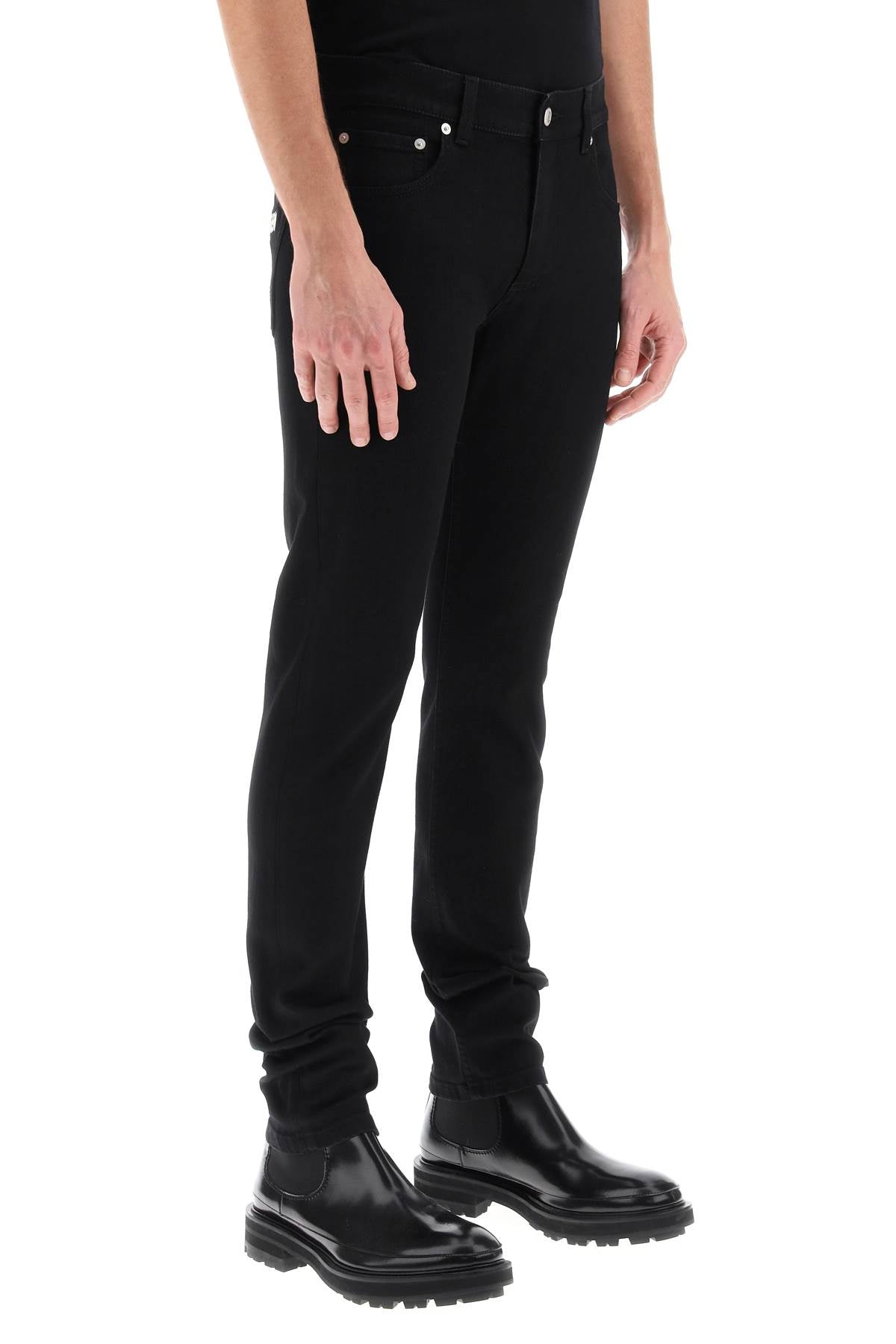 ALEXANDER MCQUEEN Slim Fit Graffiti Jeans for Stylish Men