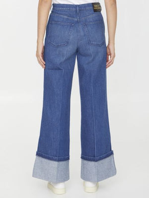 GUCCI Blue Washed Denim Wide Leg Jeans with Logo Print Detail