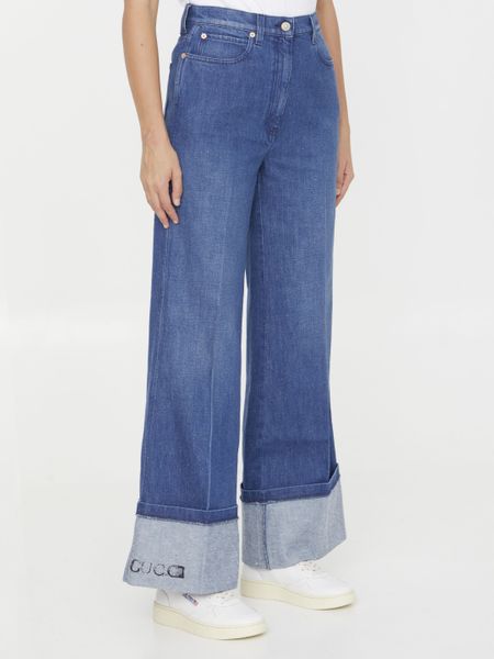 GUCCI Wide-Leg Denim Jeans with Leather Logo Tag and Roll-Up Ankle Cuffs for Women - FW23