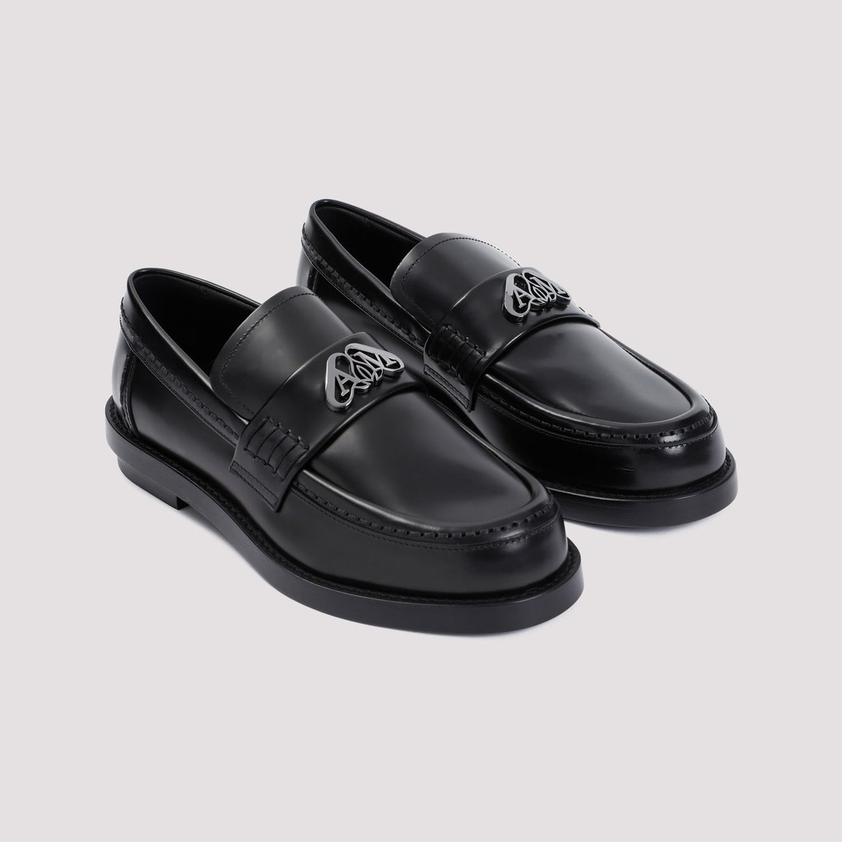 ALEXANDER MCQUEEN Edgy Black Slip-On Loafers for Women with Luxurious Silver Hardware