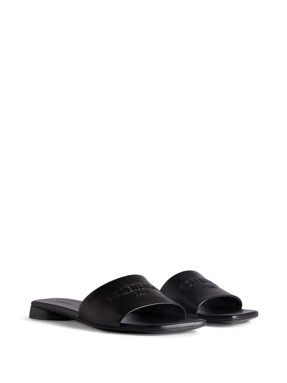 BALENCIAGA Black Leather Flat Sandals for Women with Embossed Logo and Slip-On Style