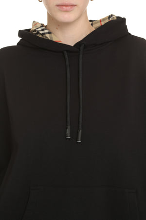 Áo khoác hoodie lớn kẻ ô cho nữ với đường cắt không đối xứng và viền hai bên