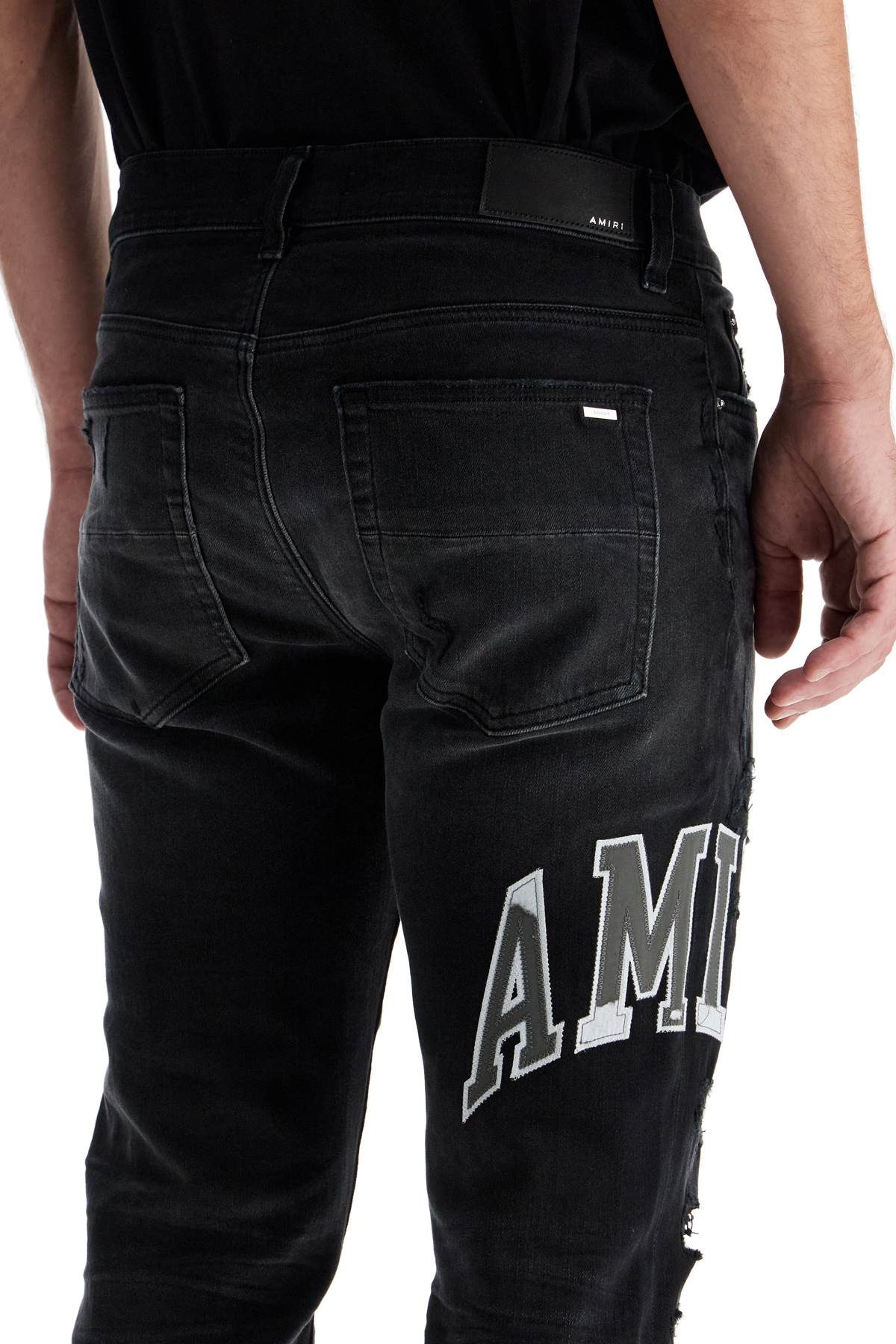 AMIRI Distressed Low-Rise Skinny Jeans with Varsity Logo - Size 31