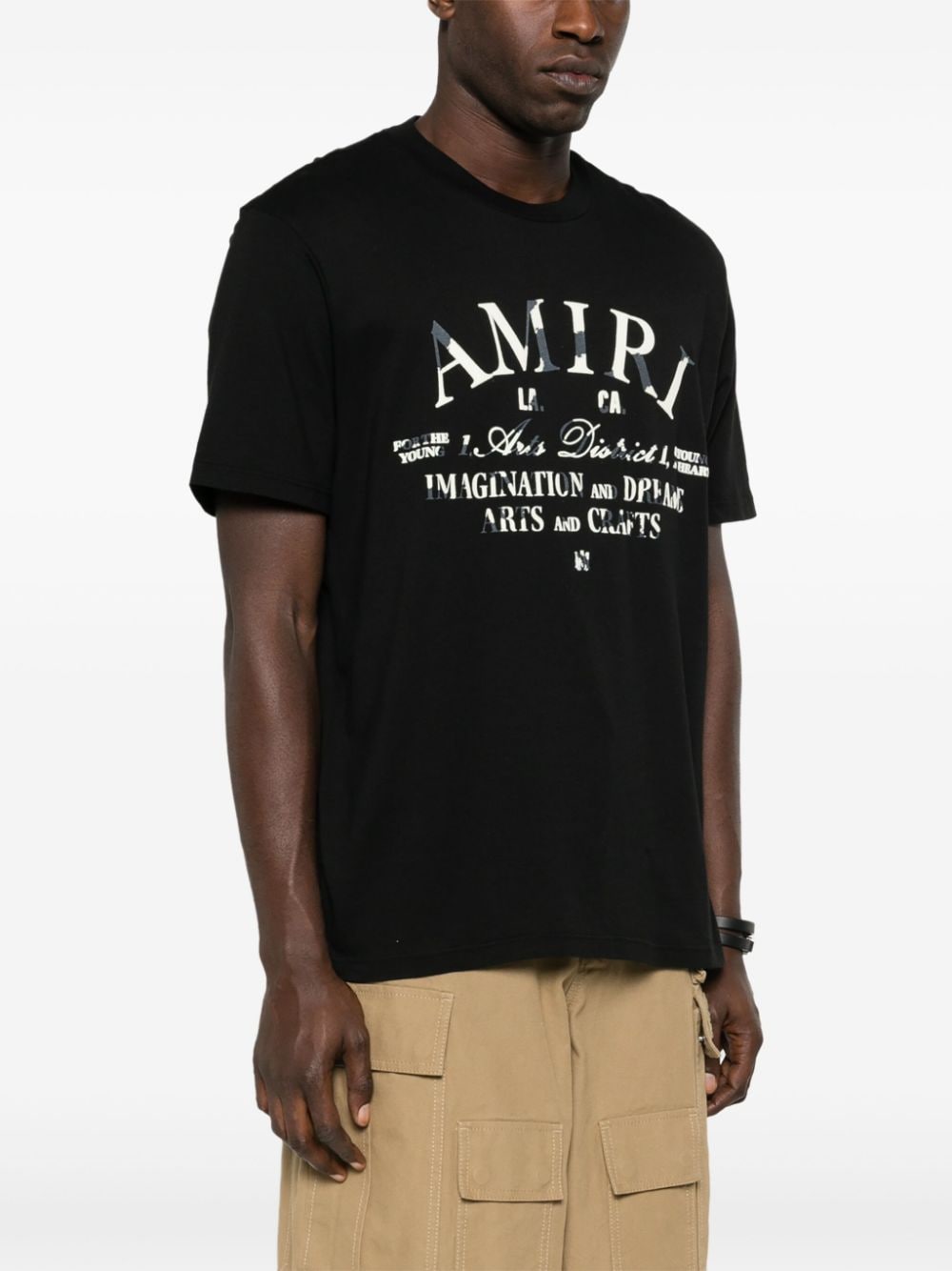 AMIRI Men's Black Soft Cotton T-Shirt with Distressed Effect and Subtle Flocked Graphics