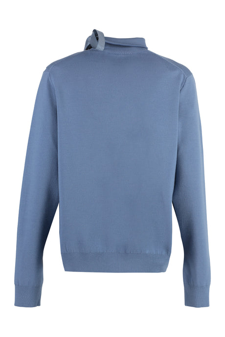 Áo len xanh với chi tiết cắt xẻ độc đáo và đường bờ có độ dốc tùy chỉnh cho bộ sưu tập nữ mùa xuân hè 23