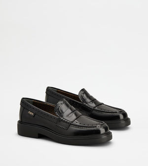 TOD'S Elegant Black Patent Leather Loafers with Brogue Detail